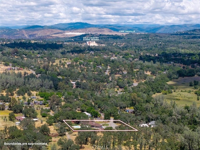 40 Gunter Ln, Oroville, CA 95966 - aerial view of property's location featuring property parcel outlined, a mountainous background, and a forest