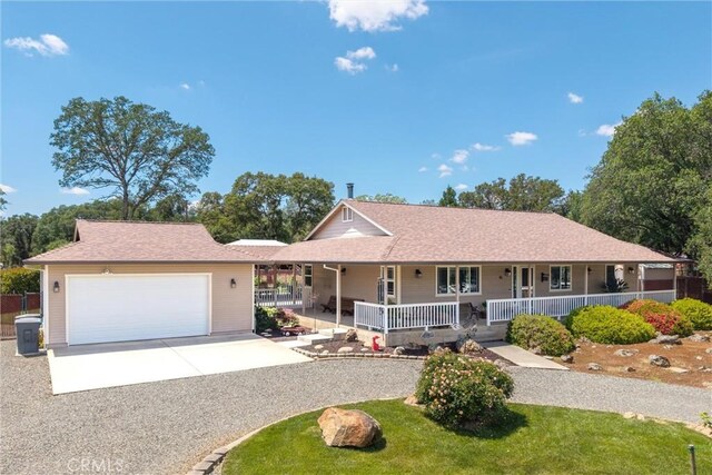 40 Gunter Ln, Oroville, CA 95966 - view of front of home featuring concrete driveway, covered porch, and a garage