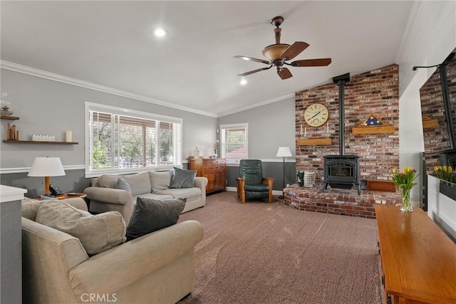 40 Gunter Ln, Oroville, CA 95966 - carpeted living area featuring a wood stove, a ceiling fan, ornamental molding, and vaulted ceiling