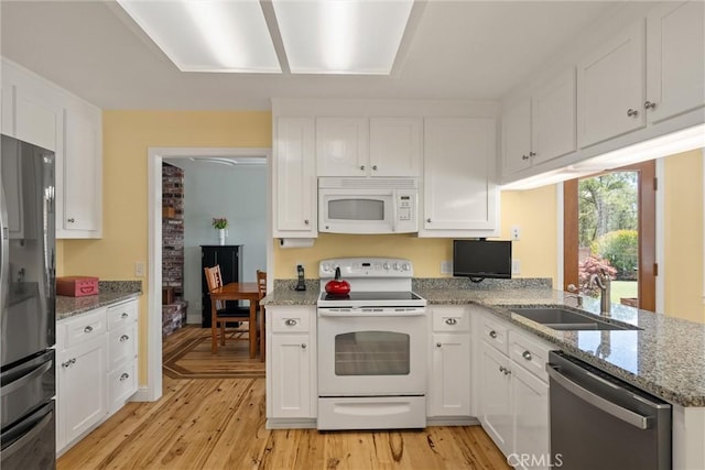 40 Gunter Ln, Oroville, CA 95966 - kitchen featuring white appliances, a sink, and white cabinetry