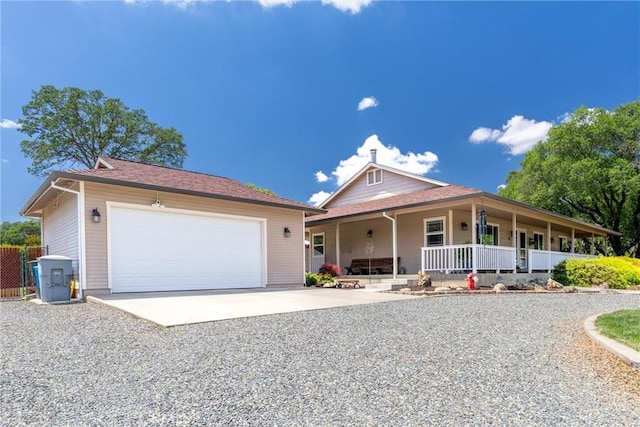 40 Gunter Ln, Oroville, CA 95966 - view of front of house with covered porch, a garage, and gravel driveway