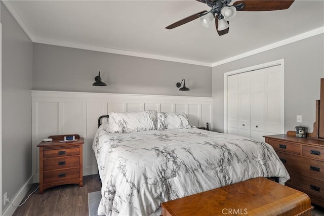 40 Gunter Ln, Oroville, CA 95966 - bedroom featuring ornamental molding, a closet, dark wood-type flooring, a wainscoted wall, and a ceiling fan