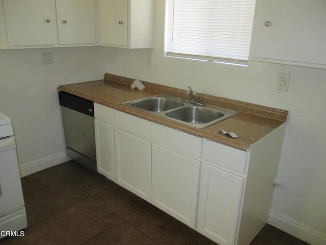 44104 Carolside Ave, Lancaster, CA 93535 - kitchen with dishwasher, white cabinetry, range, and dark tile patterned floors