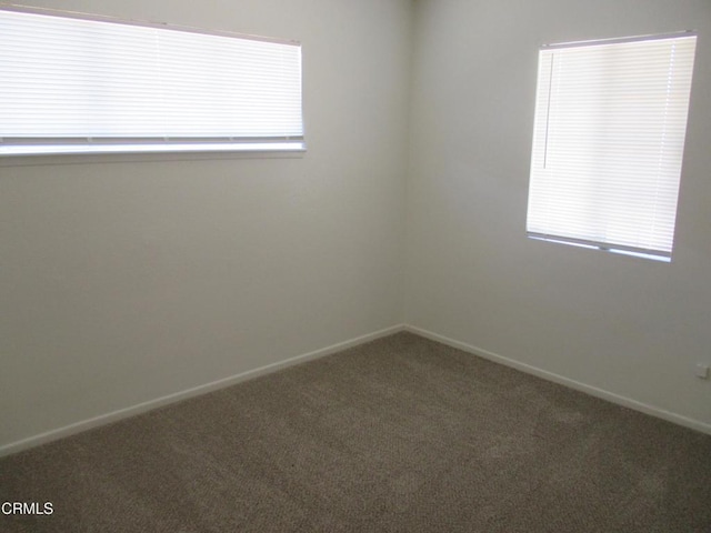44104 Carolside Ave, Lancaster, CA 93535 - carpeted empty room featuring baseboards