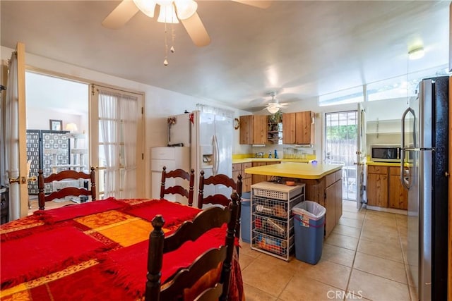 3956 Royce St, Riverside, CA 92503 - dining room with ceiling fan and light tile patterned floors