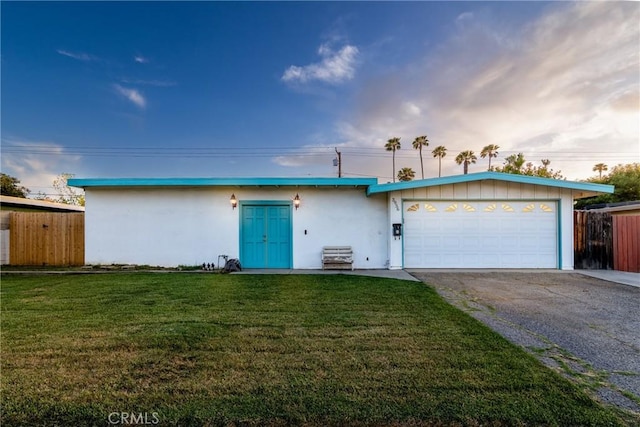 3956 Royce St, Riverside, CA 92503 - single story home with asphalt driveway, stucco siding, and an attached garage