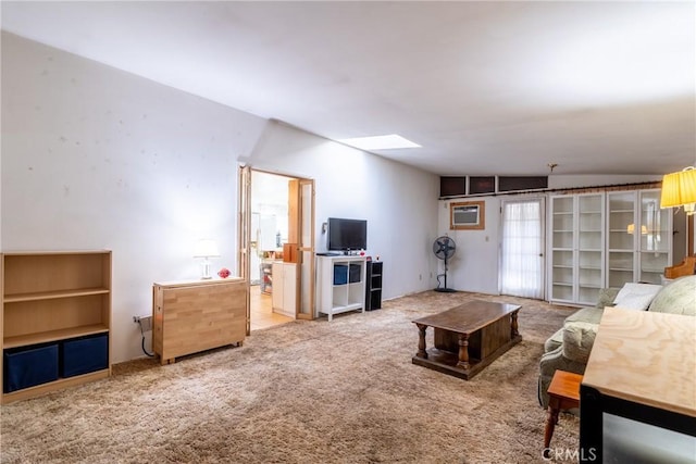 3956 Royce St, Riverside, CA 92503 - carpeted living room featuring a skylight and a wall mounted AC