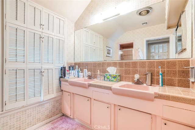 6616 Langdon Ave, Van Nuys, CA 91406 - full bathroom with lofted ceiling, a stall shower, tasteful backsplash, double vanity, and wallpapered walls