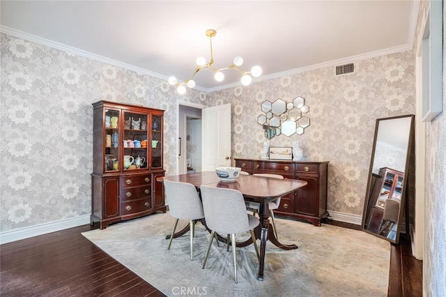 6616 Langdon Ave, Van Nuys, CA 91406 - dining room featuring wood-type flooring, a chandelier, crown molding, baseboards, and wallpapered walls
