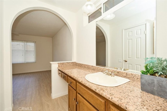 8068 Catherine Ave Unit 9, Stanton, CA 90680 - bathroom featuring wood finished floors, baseboards, and vanity