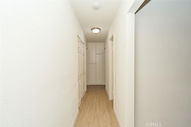 8068 Catherine Ave Unit 9, Stanton, CA 90680 - hall with light wood-style flooring and baseboards