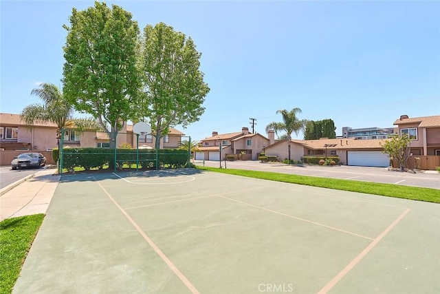 8068 Catherine Ave Unit 9, Stanton, CA 90680 - view of sport court with a residential view, fence, and community basketball court