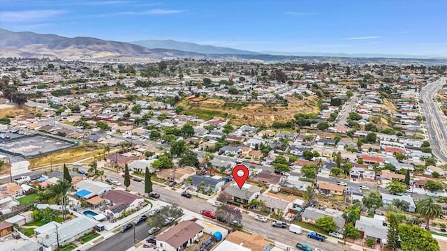 7977 Pala St, San Diego, CA 92114 - aerial view of property and surrounding area with a mountain backdrop and nearby suburban area