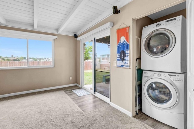 7977 Pala St, San Diego, CA 92114 - laundry room with estacked washer and dryer, carpet floors, wooden ceiling, and wood finished floors
