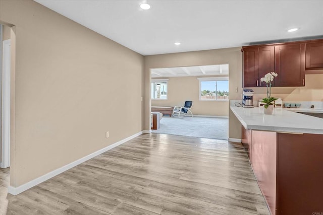 7977 Pala St, San Diego, CA 92114 - kitchen with light countertops, recessed lighting, light wood finished floors, and open floor plan