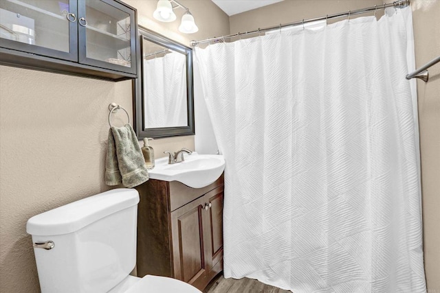 7977 Pala St, San Diego, CA 92114 - full bathroom featuring vanity, a shower with curtain, and wood finished floors