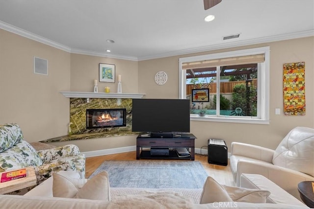 1304 Harkness St, Manhattan Beach, CA 90266 - living room featuring ornamental molding, wood finished floors, a high end fireplace, recessed lighting, and baseboards