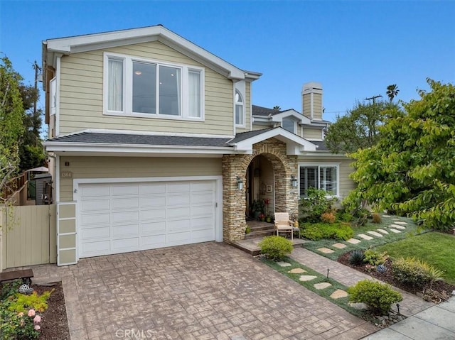 1304 Harkness St, Manhattan Beach, CA 90266 - traditional-style house with a garage, decorative driveway, fence, roof with shingles, and a chimney