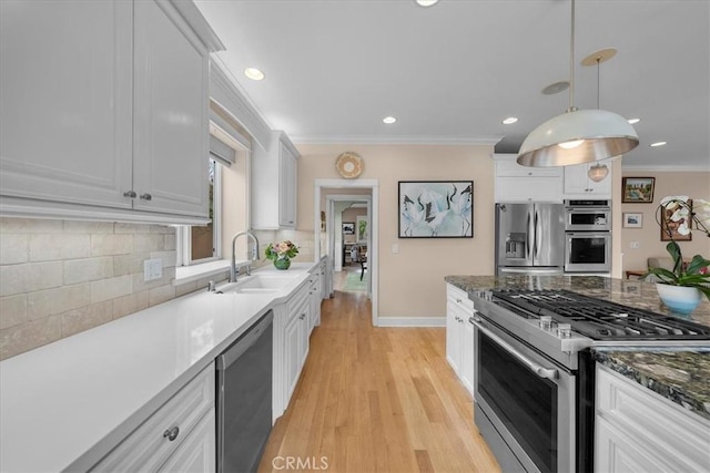 1304 Harkness St, Manhattan Beach, CA 90266 - kitchen featuring appliances with stainless steel finishes, a sink, ornamental molding, tasteful backsplash, and baseboards