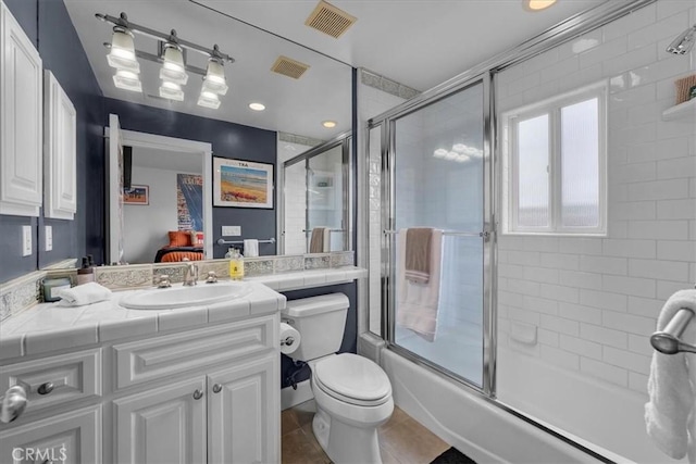 1304 Harkness St, Manhattan Beach, CA 90266 - ensuite bathroom with toilet, combined bath / shower with glass door, vanity, and tile patterned flooring