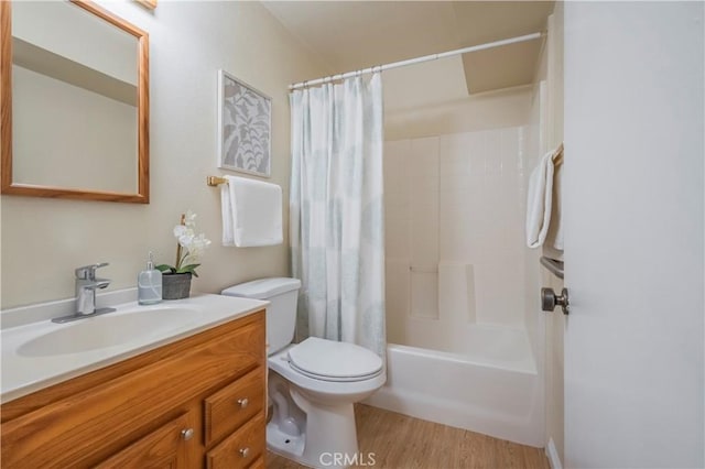 9403 Mesa Robles Dr, Whittier, CA 90603 - bathroom with toilet, vanity, wood finished floors, and shower / bathtub combination with curtain