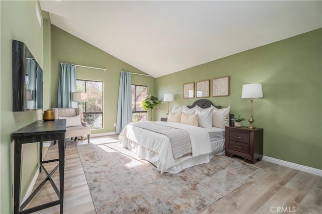 9403 Mesa Robles Dr, Whittier, CA 90603 - bedroom with lofted ceiling, baseboards, and light wood finished floors