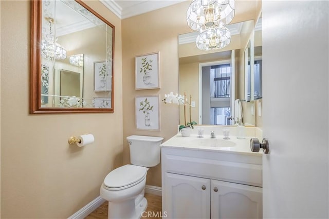9403 Mesa Robles Dr, Whittier, CA 90603 - half bathroom with a chandelier, ornamental molding, baseboards, toilet, and vanity