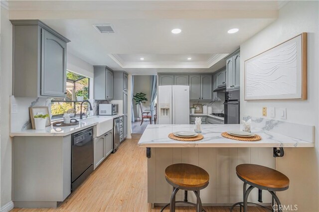 9403 Mesa Robles Dr, Whittier, CA 90603 - kitchen with black appliances, a peninsula, gray cabinets, a sink, and crown molding