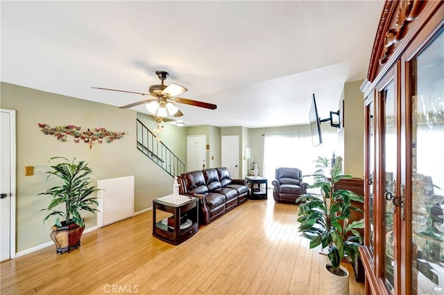7226 Jordan Ave Unit 6, Canoga Park, CA 91303 - living room with a ceiling fan, light wood-type flooring, stairs, and baseboards