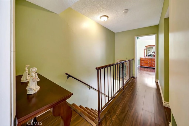 7226 Jordan Ave Unit 6, Canoga Park, CA 91303 - hall featuring an upstairs landing, a textured ceiling, and baseboards