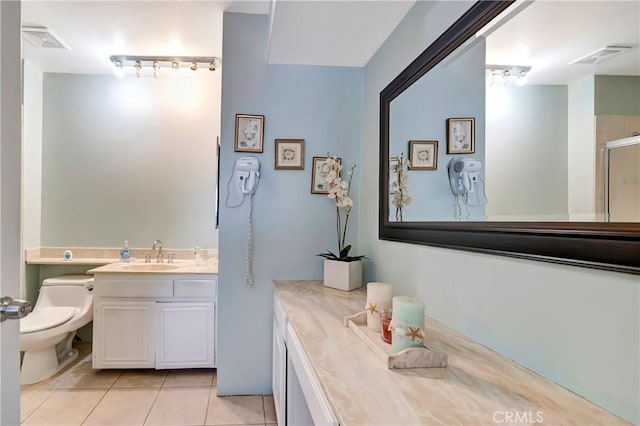 7226 Jordan Ave Unit 6, Canoga Park, CA 91303 - bathroom with vanity, tile patterned floors, toilet, and an enclosed shower