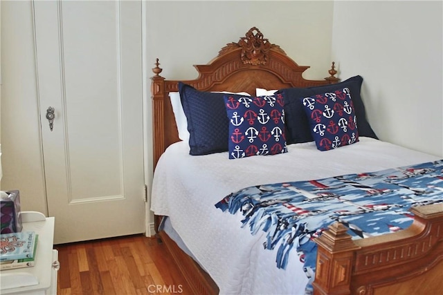 bedroom with wood finished floors