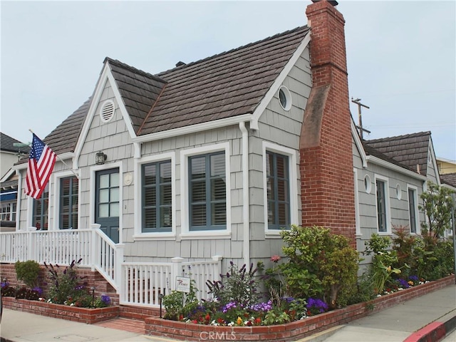 view of side of property with a chimney