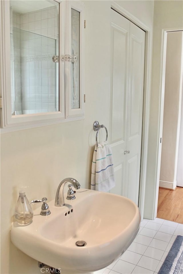 bathroom featuring a sink and tile patterned flooring