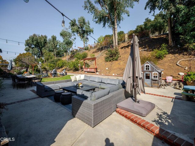2956 Wauneta St, Newbury Park, CA 91320 - view of patio with an outdoor hangout area, outdoor dining space, an outdoor structure, and fence