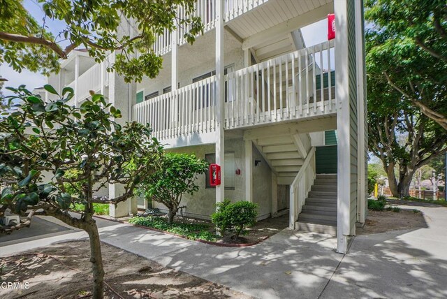 view of property with stairway