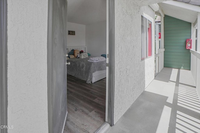 doorway to property featuring stucco siding