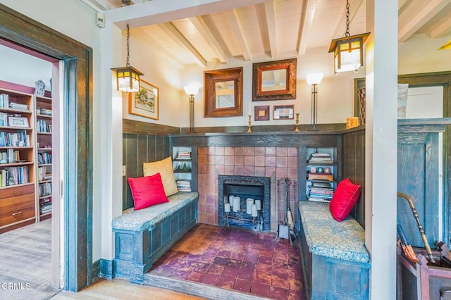 591 N Oakland Ave, Pasadena, CA 91101 - living area with beam ceiling, a tile fireplace, and wood finished floors