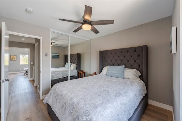27483 Dandelion Ct, Temecula, CA 92591 - bedroom featuring wood finished floors, a closet, baseboards, and a ceiling fan