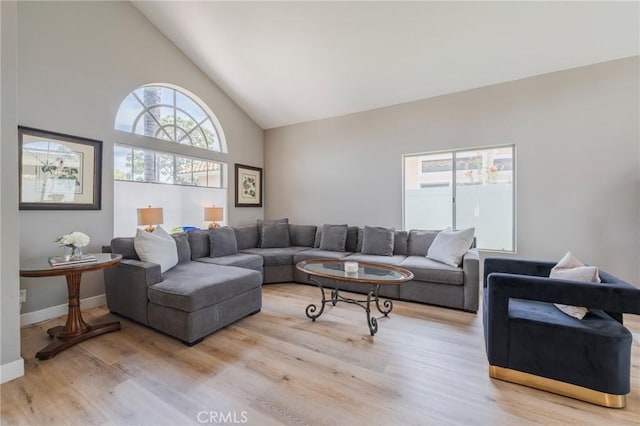 27483 Dandelion Ct, Temecula, CA 92591 - living room with wood finished floors, high vaulted ceiling, and baseboards