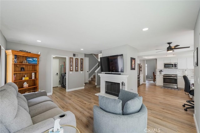 27483 Dandelion Ct, Temecula, CA 92591 - living area featuring baseboards, recessed lighting, ceiling fan, light wood-style floors, and stairs