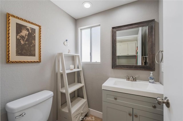 27483 Dandelion Ct, Temecula, CA 92591 - bathroom featuring toilet, vanity, and baseboards