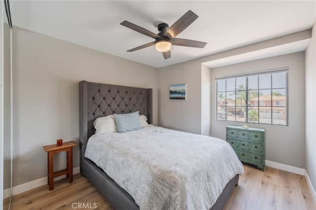 27483 Dandelion Ct, Temecula, CA 92591 - bedroom with baseboards, light wood-style flooring, and a ceiling fan