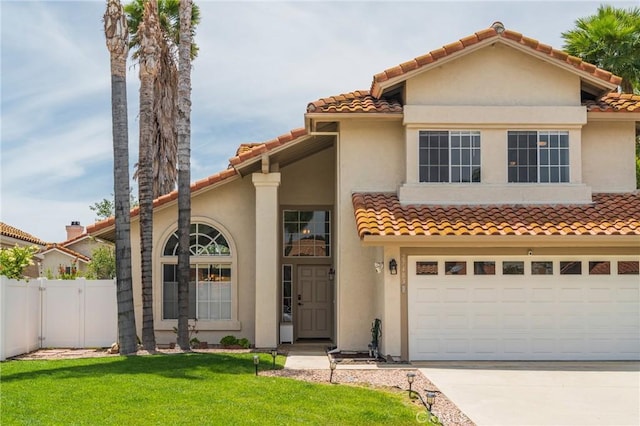 27483 Dandelion Ct, Temecula, CA 92591 - mediterranean / spanish house featuring a tile roof, concrete driveway, stucco siding, and an attached garage