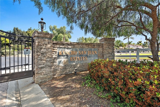 28881 Via Hacienda, San Juan Capistrano, CA 92675 - community / neighborhood sign featuring a gate and fence