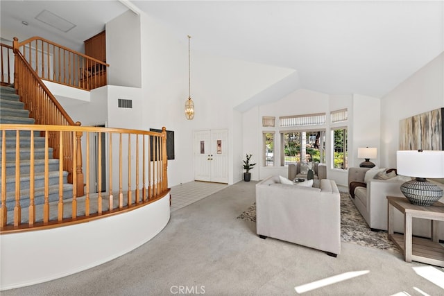 28881 Via Hacienda, San Juan Capistrano, CA 92675 - living room with carpet floors, high vaulted ceiling, and stairs