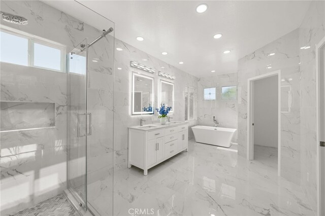 18660 Sunset Knoll Dr, Riverside, CA 92504 - bathroom featuring recessed lighting, a marble finish shower, healthy amount of natural light, a freestanding bath, and tile walls
