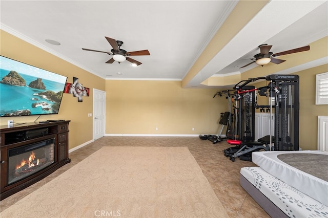 18660 Sunset Knoll Dr, Riverside, CA 92504 - workout room featuring a ceiling fan, crown molding, a glass covered fireplace, baseboards, and carpet floors