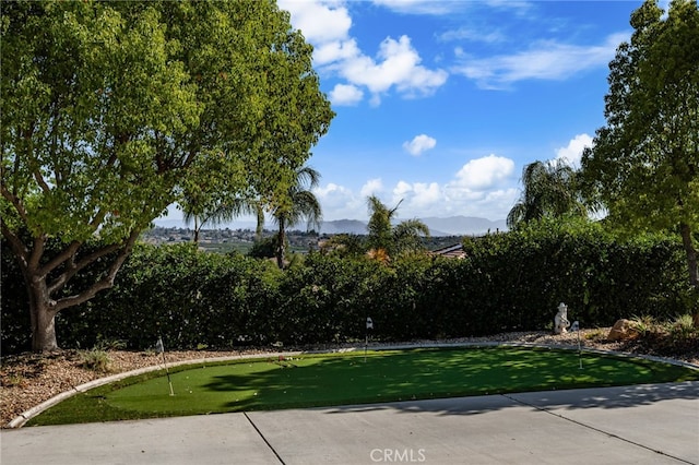 18660 Sunset Knoll Dr, Riverside, CA 92504 - view of yard with a putting area and a mountain view