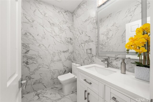 18660 Sunset Knoll Dr, Riverside, CA 92504 - bathroom with marble finish floors, vanity, toilet, and tile walls